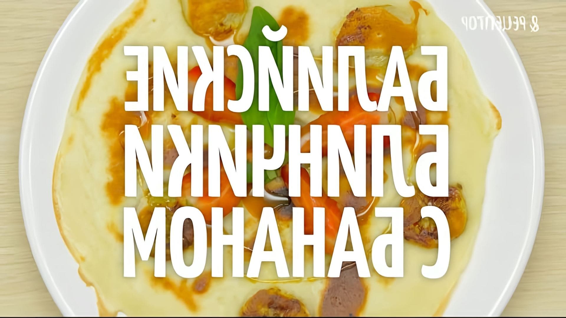Видео-ролик под названием "Балийские блинчики с бананом" от Рецептор представляет собой рецепт приготовления традиционного балийского блюда