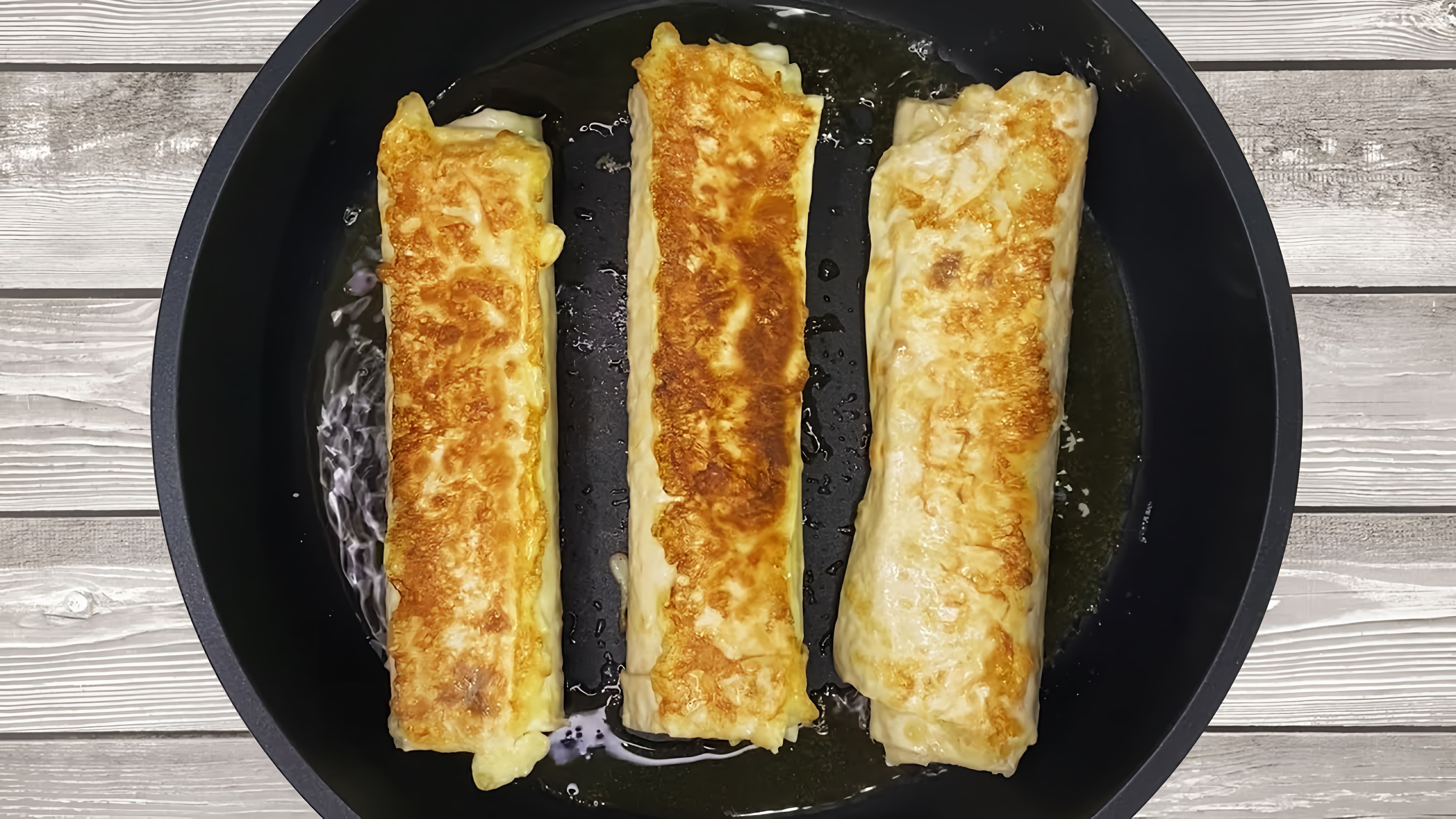В этом видео-ролике показан процесс приготовления вкусного и легкого завтрака - лаваша с сыром и яйцом на сковороде